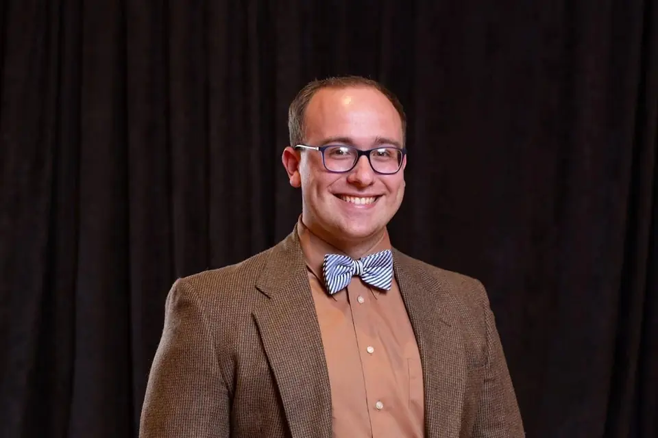 Graeme Gross, portrait in a tweed jacket and bow tie